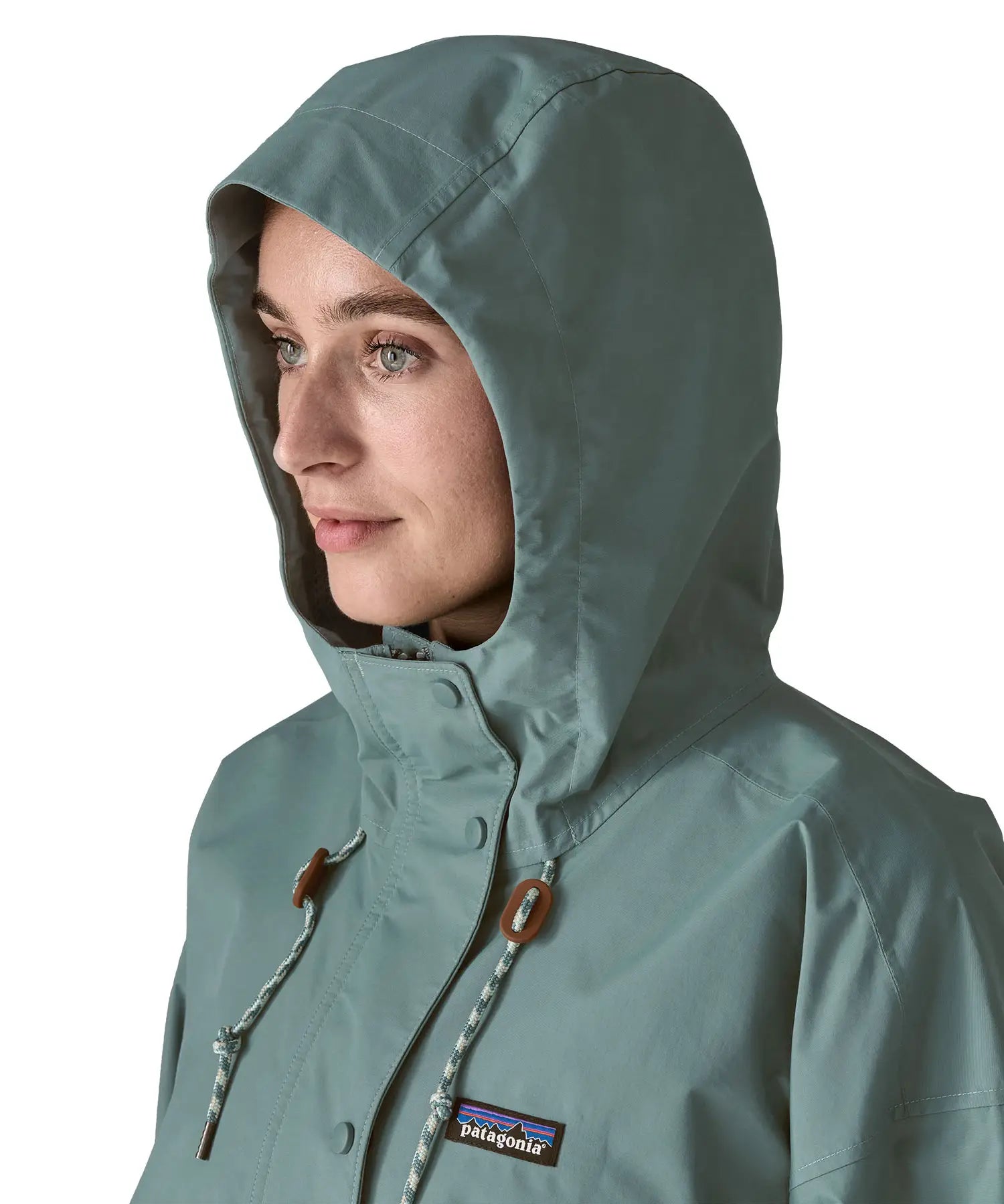 Woman wearing Patagonia outdoor everyday rain jacket in blue sage showing close up the adjustable hood