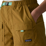 Close up of woman wearing Patagonia women's outdoor everyday quick drying shorts in brown with hand in side pocket