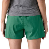 Back of woman wearing Patagonia's women's outdoor everyday shorts in green
