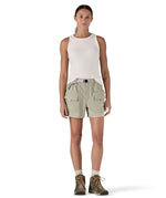 Front of Woman wearing Patagonia's women's outdoor everyday shorts in light grey. Shorts have a loose fit and sit over the knees