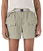 Woman wearing Patagonia's women's outdoor everyday shorts in light grey. Shows front pockets. Shorts have a loose fit