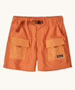 Patagonia women's outdoor everyday quick drying shorts in orange with contrast front pockets. Features side pockets and matching orange belt