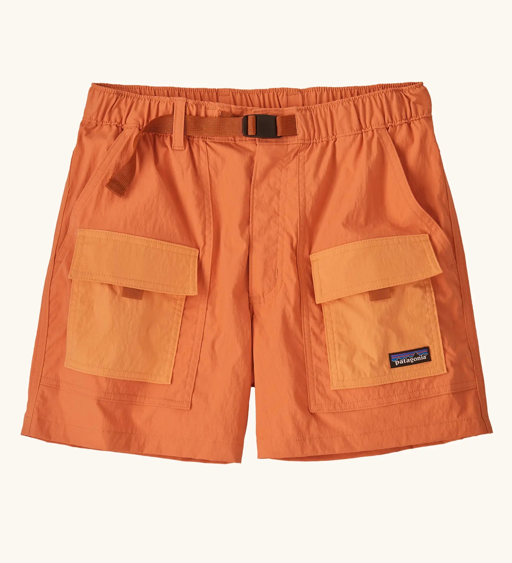 Patagonia women's outdoor everyday quick drying shorts in orange with contrast front pockets. Features side pockets and matching orange belt