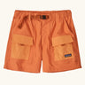 Patagonia women's outdoor everyday quick drying shorts in orange with contrast front pockets. Features side pockets and matching orange belt