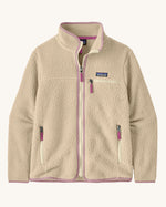 Patagonia Women's thick fleece jacket in a cream colour with light purple trim. Features a full length front zip, side pockets and a zipped chest pocket