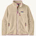 Patagonia Women's thick fleece jacket in a cream colour with light purple trim. Features a full length front zip, side pockets and a zipped chest pocket