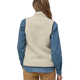 A model wearing the Patagonia womens retro pile vest in pelican available at Babipur showing the back fit of the gilet 