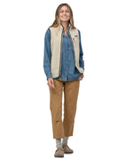 A model wearing the Patagonia womens retro pile vest in pelican available at Babipur showing the front fit of the gilet with the zip open