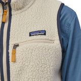 A close up of the Patagonia womens retro pile vest in pelican available at Babipur showing the front zip pocket detail