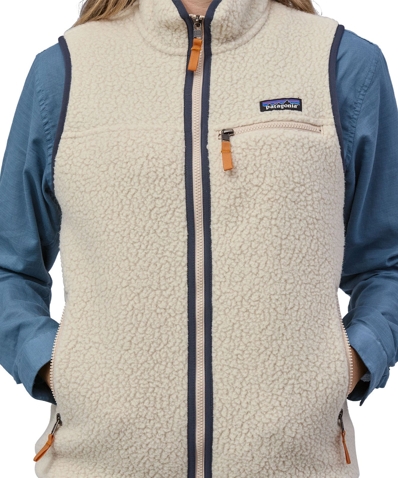 A close up of the Patagonia womens retro pile vest in pelican available at Babipur showing the full length zip detail