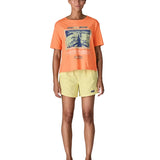 Woman Patagonia women's easy cut short sleeve t-shirt in bright orange. T-shirt has a boxy fit and sits at the hips