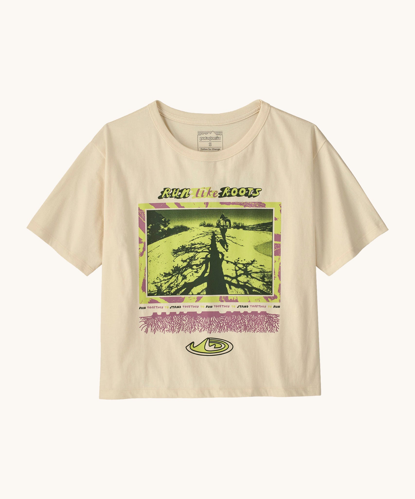 Patagonia women's easy cut short sleeve t-shirt in cream with retro run like roots graphic on the front