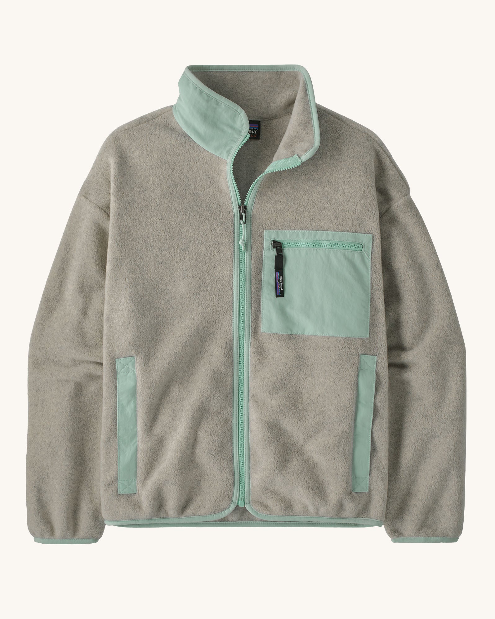 Patagonia women's synchilla fleece jacket in light grey and blue trim. With a full length front zip, side pockets and alight blue patch pocket