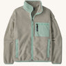 Patagonia women's synchilla fleece jacket in light grey and blue trim. With a full length front zip, side pockets and alight blue patch pocket
