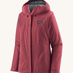 Patagonia women's torrentshell 3L jacket in a red colour on a cream background.