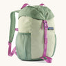 The Patagonia Kids Refugito 12L Backpack   in ellwood green , a pastel green backpack pink buckle and handle detail. Features 2 side mesh pockets in contrast green. A Logo patch is stitched on the front panel.