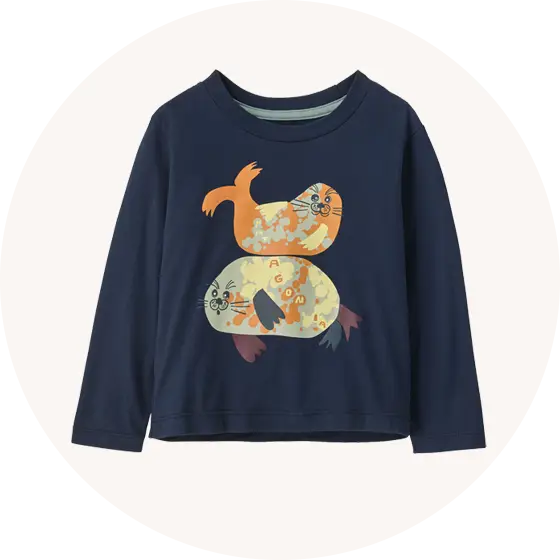 Button for Patagonia Kids' Tops and Tees collection at Babipur, with Baby Long Sleeved Graphic T-Shirt in Blubby Buddies / New Navy representing the page. 