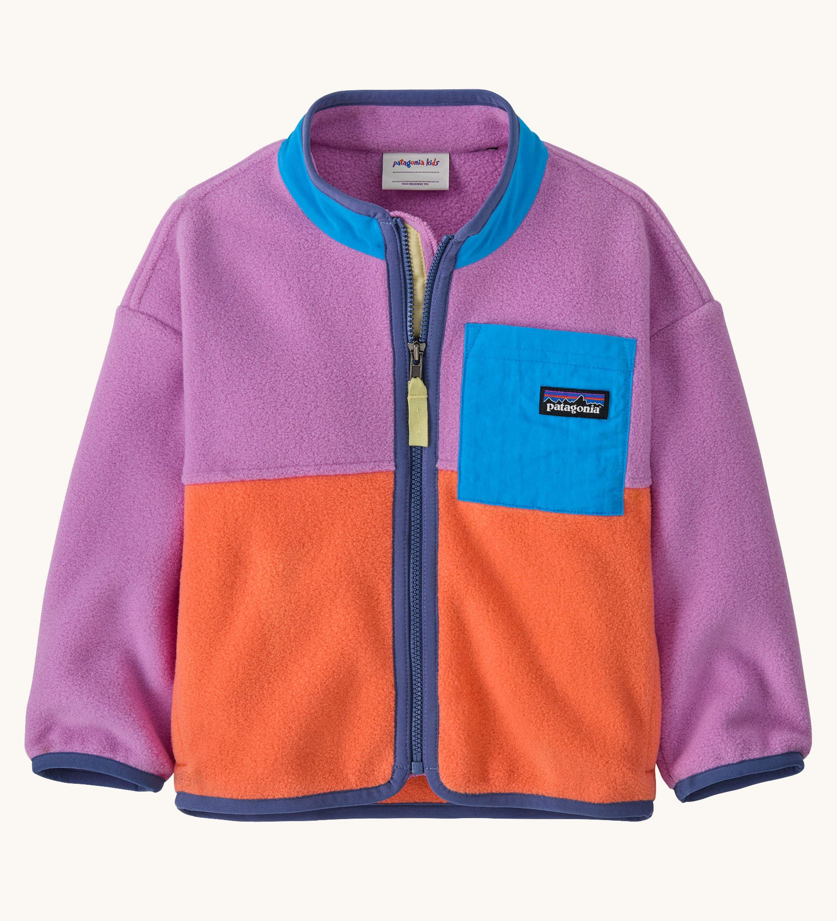 Patagonia little kids synchilla fleece in brisk purple available at Babipur. A 100% recycled polyester soft fleece jacket in bright purple and orange with purple trim. Features a full length zip and a blue chest pocket
