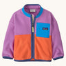 Patagonia little kids synchilla fleece in brisk purple available at Babipur. A 100% recycled polyester soft fleece jacket in bright purple and orange with purple trim. Features a full length zip and a blue chest pocket