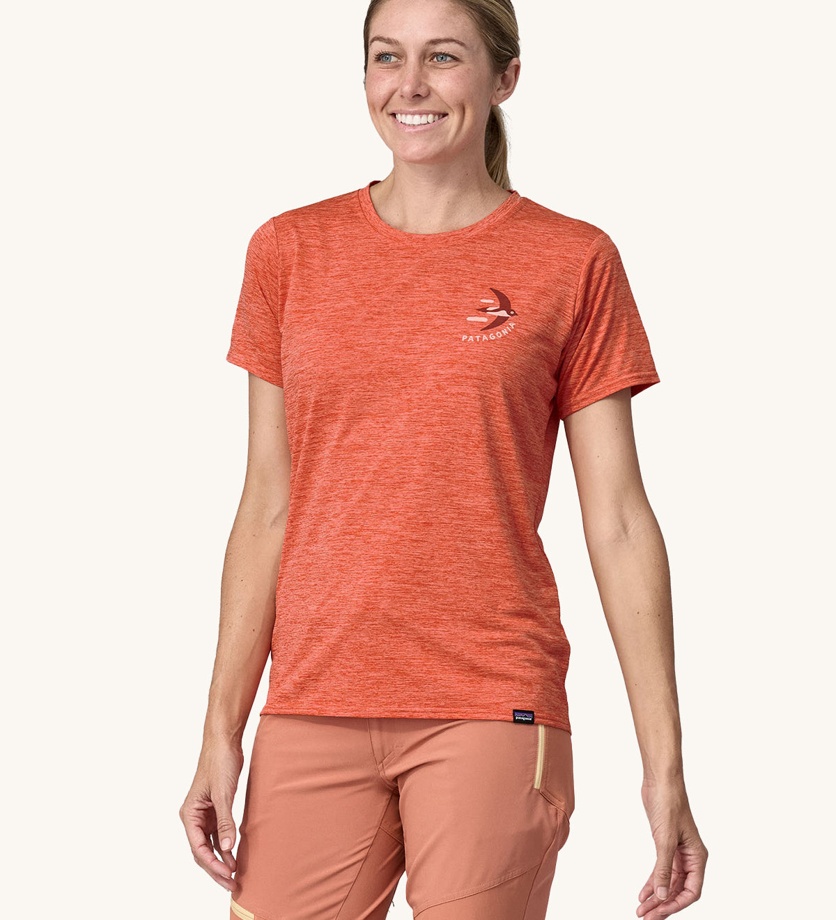 An adult wearing a Patagonia Women's Cap Cool Daily Graphic Shirt, showing the fit of the top from the front.