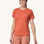 An adult wearing a Patagonia Women's Cap Cool Daily Graphic Shirt, showing the fit of the top from the front.