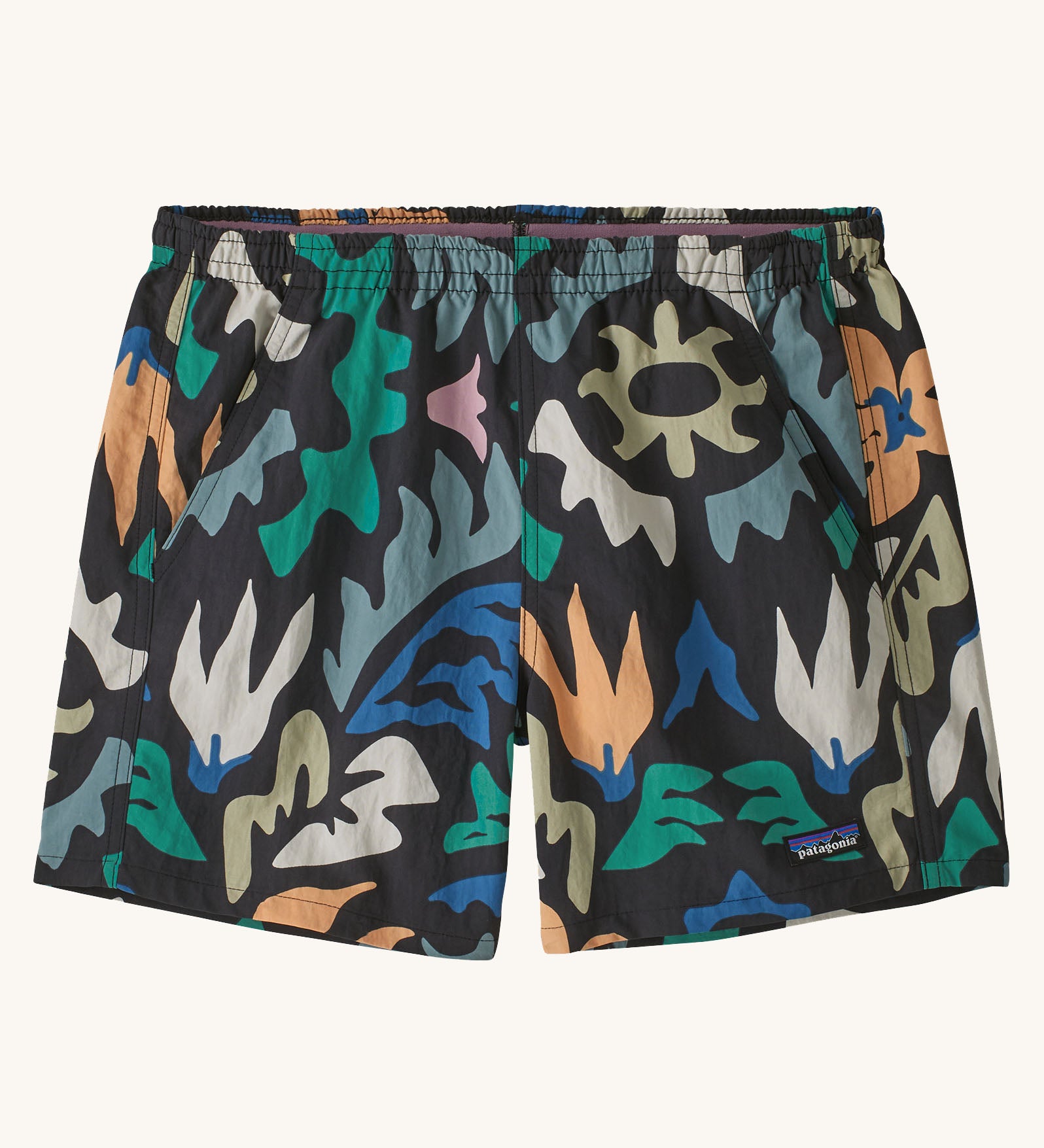Patagonia quick drying women's baggies shorts in black with repeating abstract design. Shows 2 front pockets