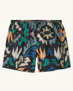 Patagonia quick drying women's baggies shorts in black with repeating abstract design. Shows 2 front pockets