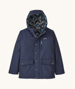 The Kids infurno fleece-lined coat from Patagonia, with a patterned inner lining and a navy outer.