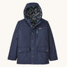 The Kids infurno fleece-lined coat from Patagonia, with a patterned inner lining and a navy outer.