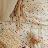 Peaches Avery Row Organic Cotton Bedding Set with soft cuddly toys set on the bedding