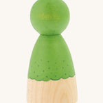 The back of the Peepul handmade wooden broccoli peg doll toy, in green, on a cream background