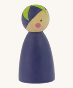 A side view of the Peepul Aubergine Peg Doll showing more of the hand painted green leaf on the top of the figure. The image is on a cream background
