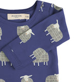 A close up of the Pigeon Organics navy sheep body showing the popper fastener detail on the shoulder
