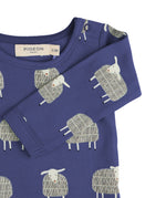 A close up of the Pigeon Organics navy sheep body showing the popper fastener detail on the shoulder