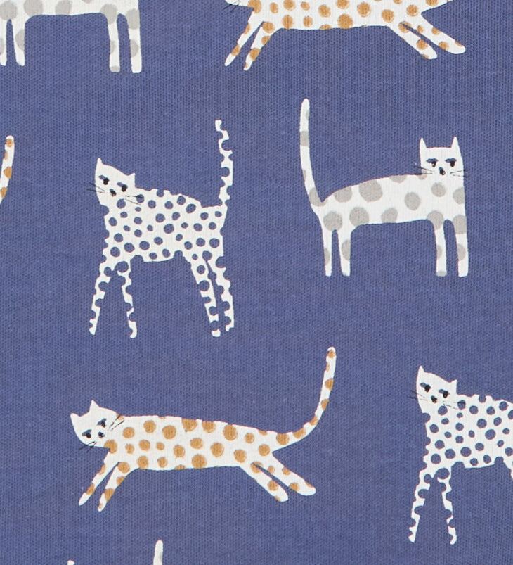 A close up of the cat print on the inner liner of the Pigeon Organics baby jacket in velvet blue available at Babipur