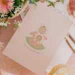 The Olli Ella Limited Edition Blossom Buds Gift Set - Tulip box on a pink background with flowers