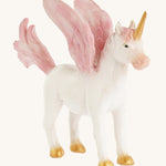 A closer look at the The Green Rubber Toys Rainbow Pegasus with a white body and pink details on the wings, tails and mane and golden hooves and horn.