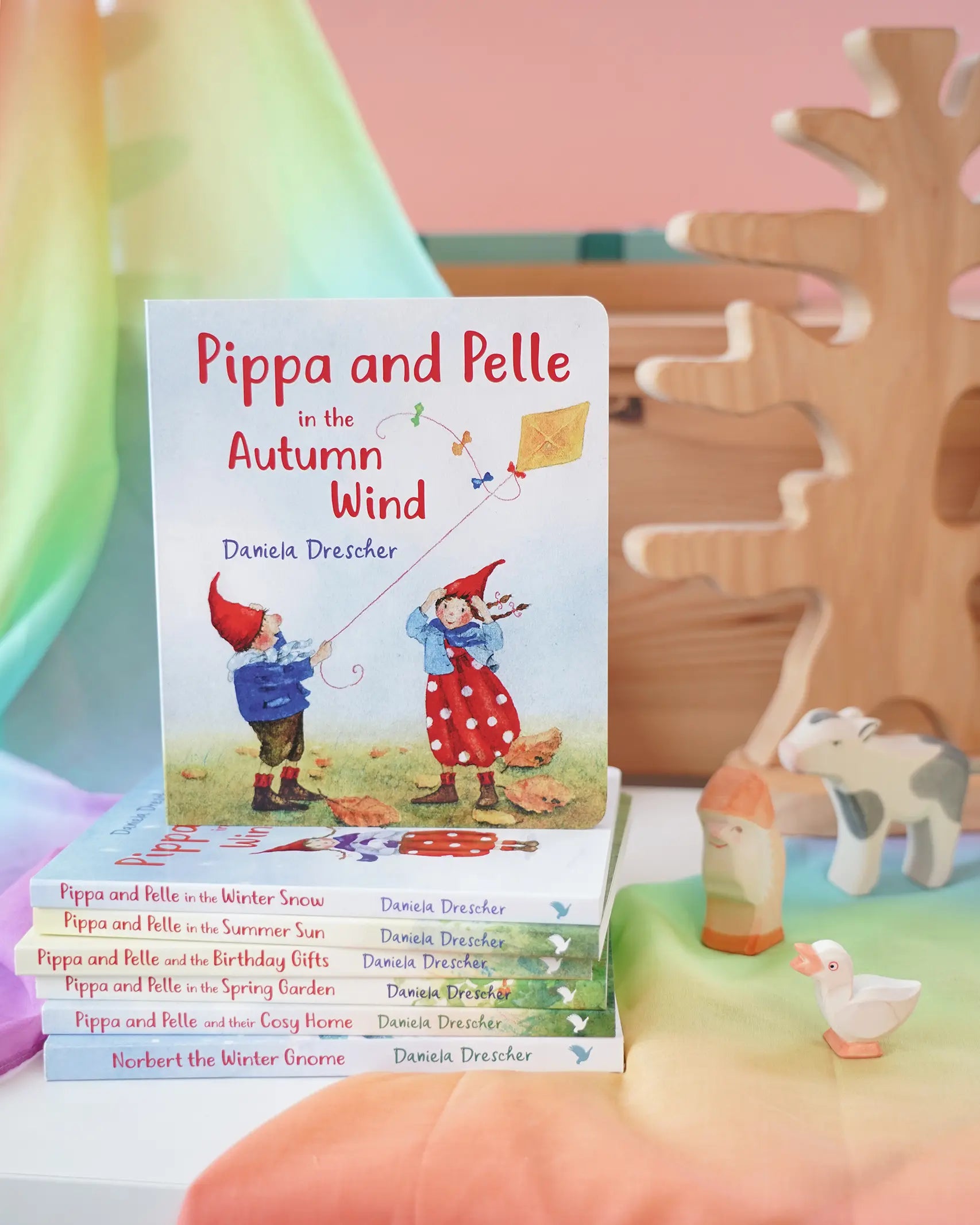 Pippa and Pelle autumn wind children's board book by Daniela Drescher, stacked with books from that series, in the Babipur playroom. 