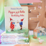 Pippa and Pelle Birthday Gift children's board book by Daniela Drescher, stacked with books from that series, in the Babipur playroom. 