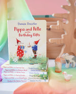 Pippa and Pelle Birthday Gift children's board book by Daniela Drescher, stacked with books from that series, in the Babipur playroom. 