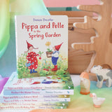 Pippa and Pelle Spring Garden children's board book by Daniela Drescher, stacked with books from that series, in the Babipur playroom. 