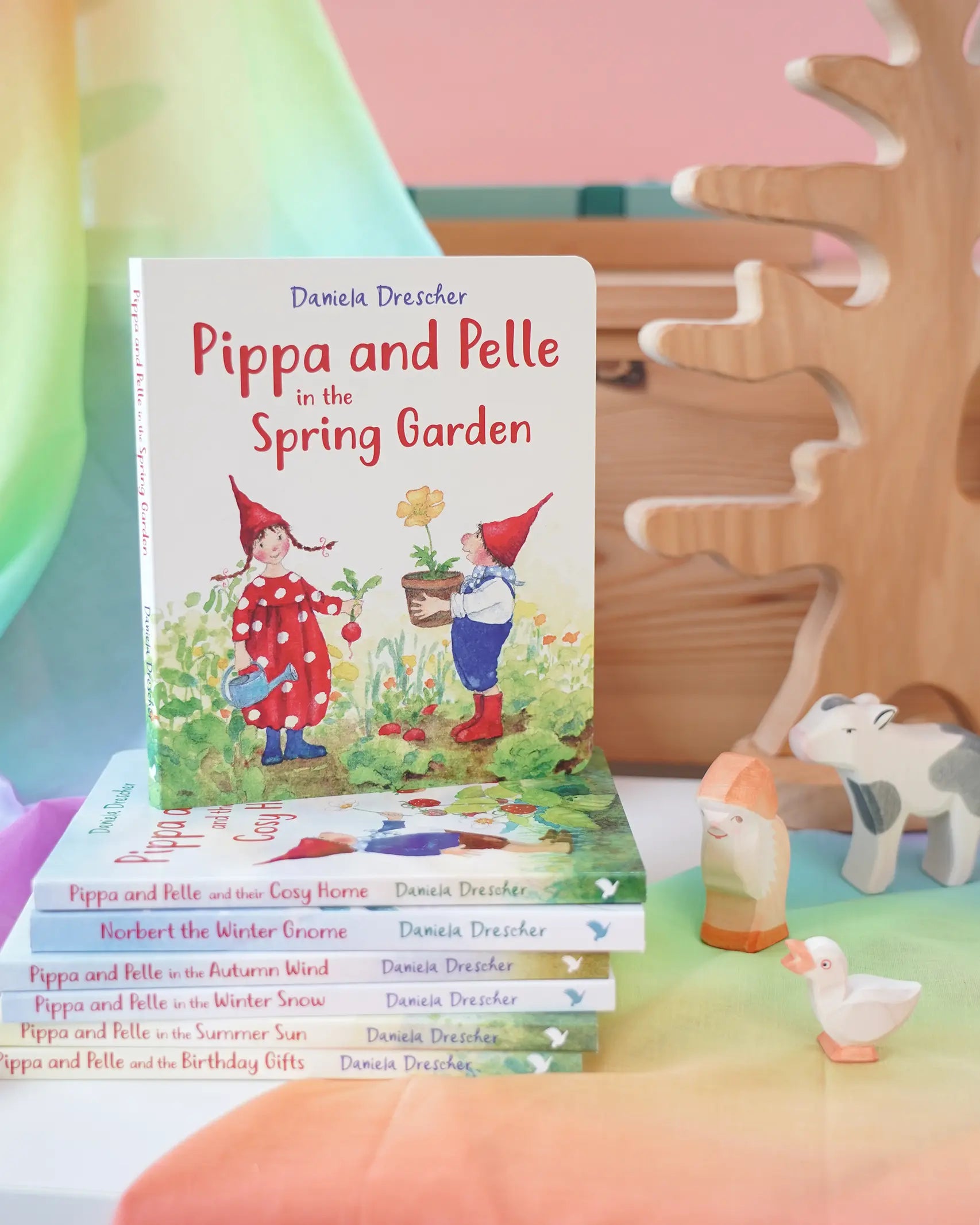 Pippa and Pelle Spring Garden children's board book by Daniela Drescher, stacked with books from that series, in the Babipur playroom. 