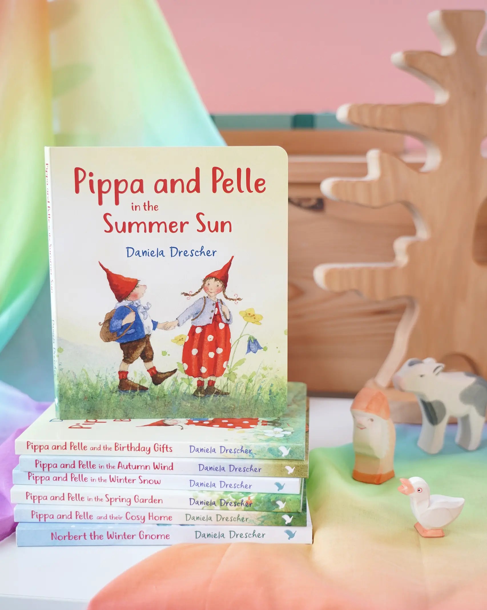 Pippa and Pelle Summer Sun children's board book by Daniela Drescher, stacked with books from that series, in the Babipur playroom. 