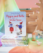 Pippa and Pelle Winter Snow children's board book by Daniela Drescher, stacked with books from that series, in the Babipur playroom. 