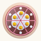 Overheard view of a PlanToys birthday cake wooden set showing brown slices with candles on a serving plate