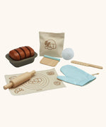 PlanToys bread loaf play set. Includes a loaf to cut, tray, cotton bag, oven mitt and baking tools