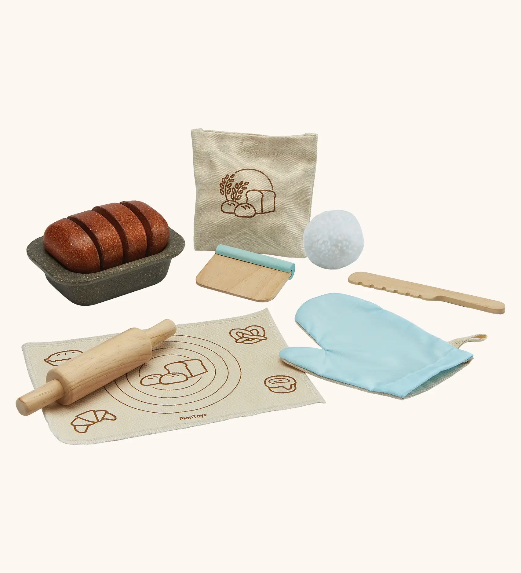 PlanToys bread loaf play set. Includes a loaf to cut, tray, cotton bag, oven mitt and baking tools