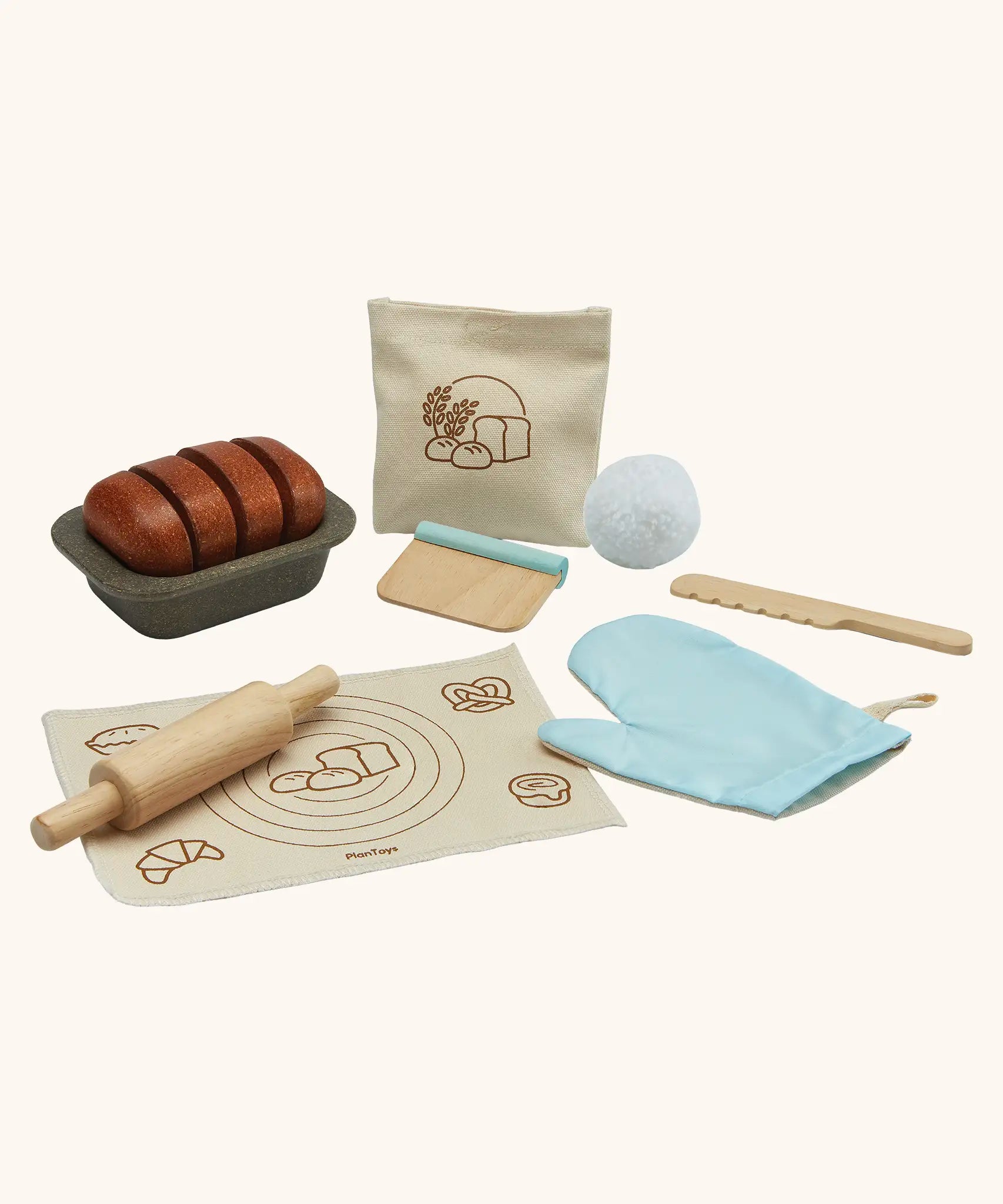 PlanToys bread loaf play set. Includes a loaf to cut, tray, cotton bag, oven mitt and baking tools