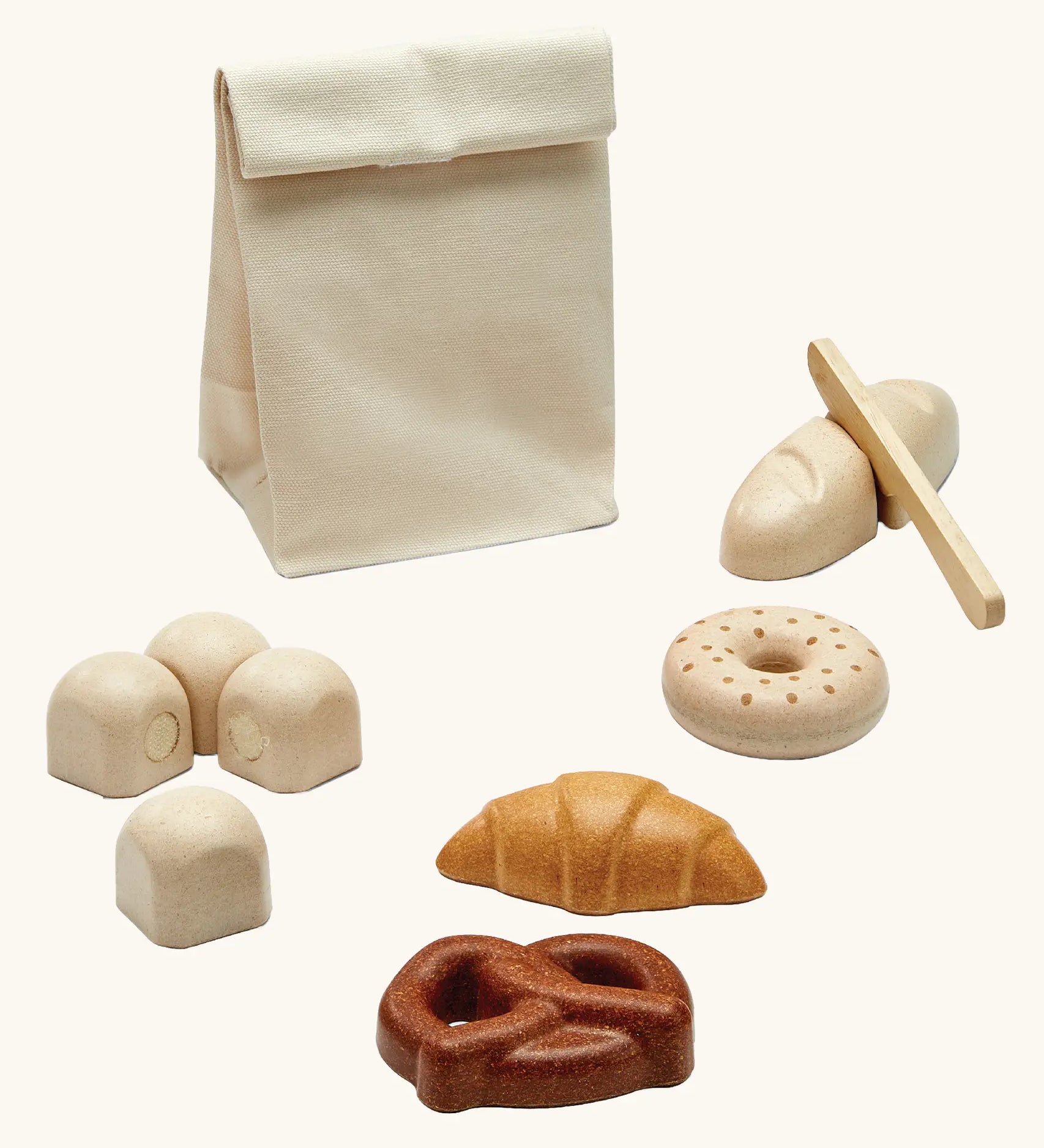 PlanToys wooden bread play set. Includes a cotton bag, rolls with velcro tabs, a knife and pastries 