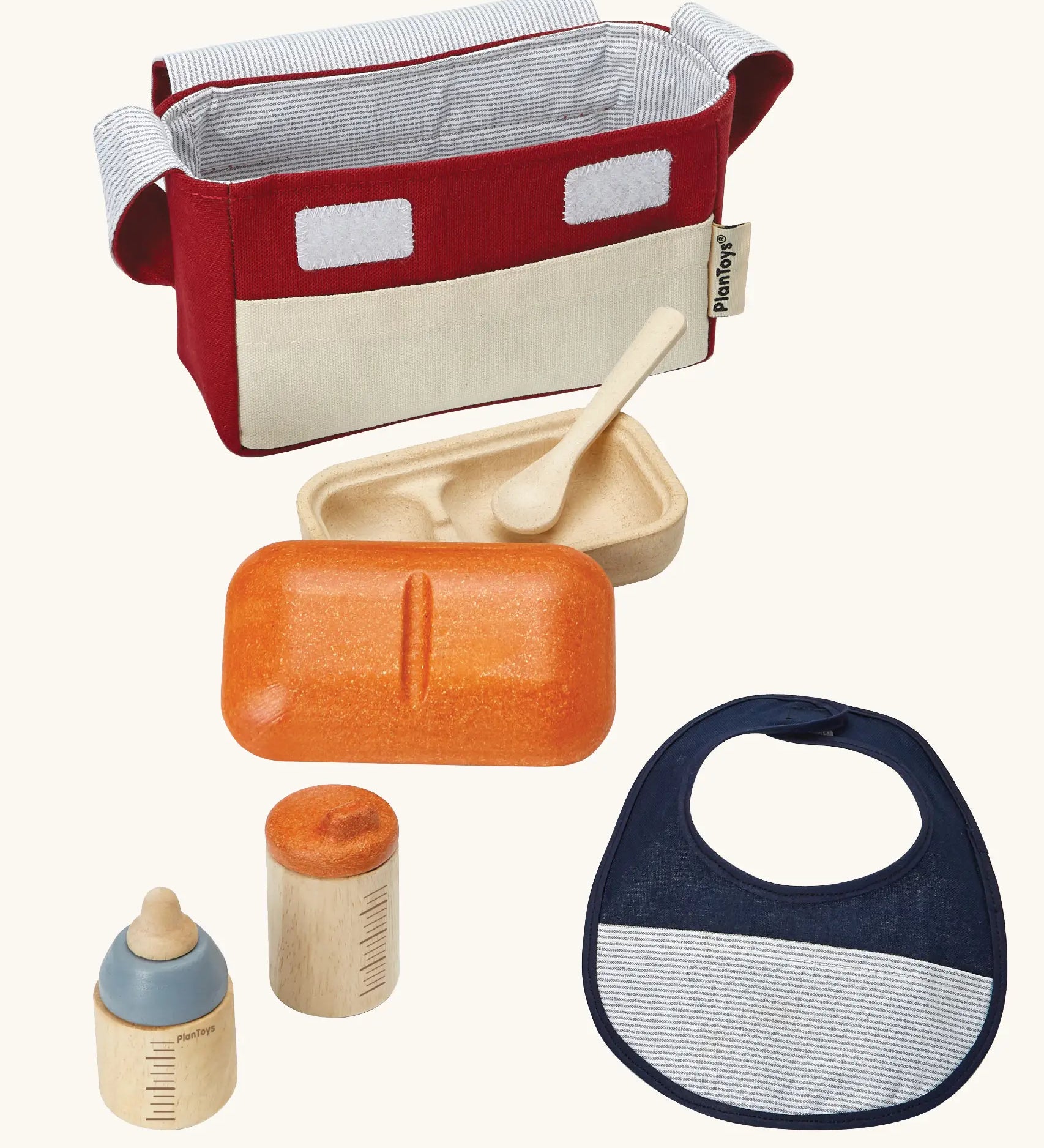 PlanToys doll feeding set. Includes a carry bag, bottles, bib and a bowl